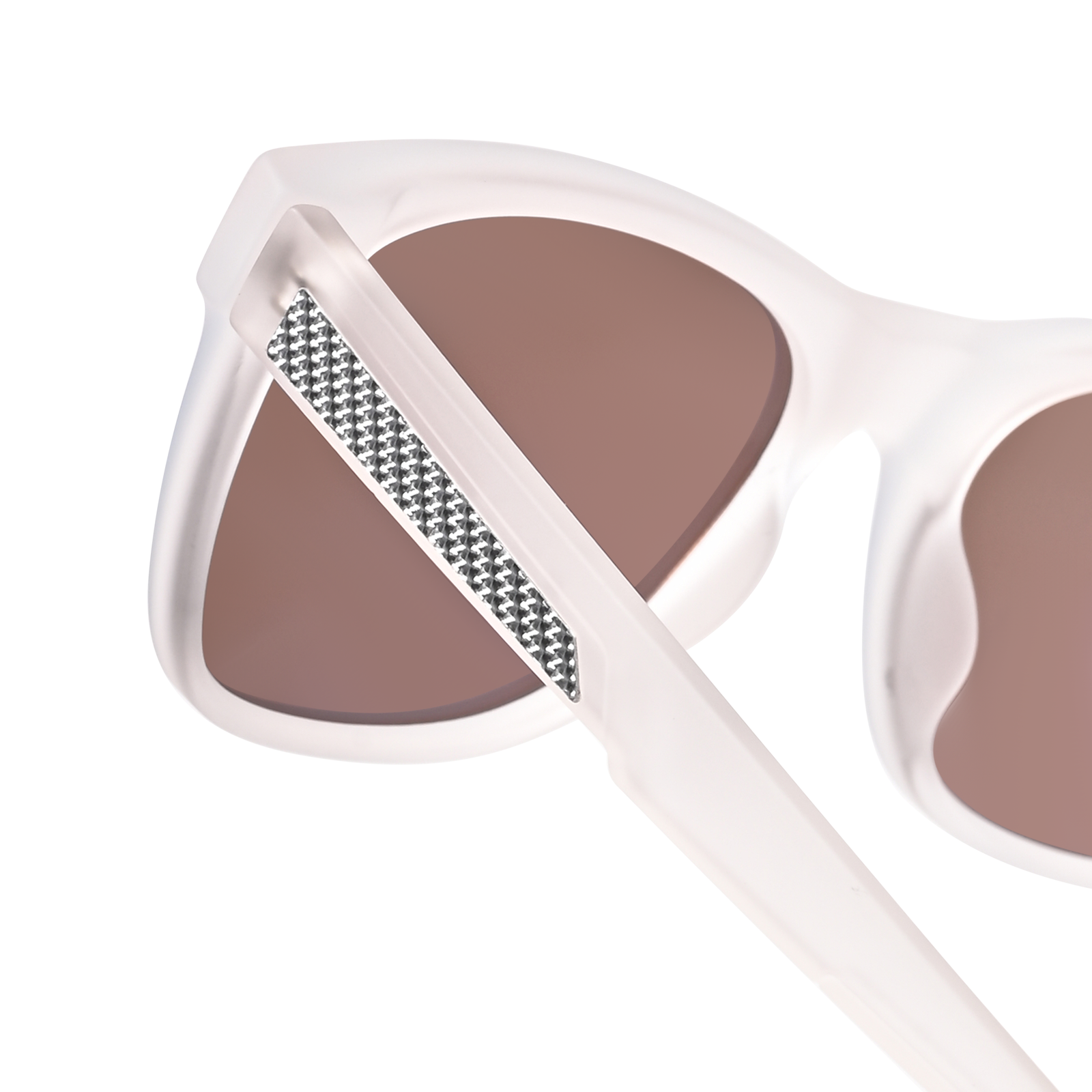Close-up view of Aventus - Matte Ivory sunglasses featuring a matte ivory frame, brown tinted lenses, and a textured silver detail on the temple arm.