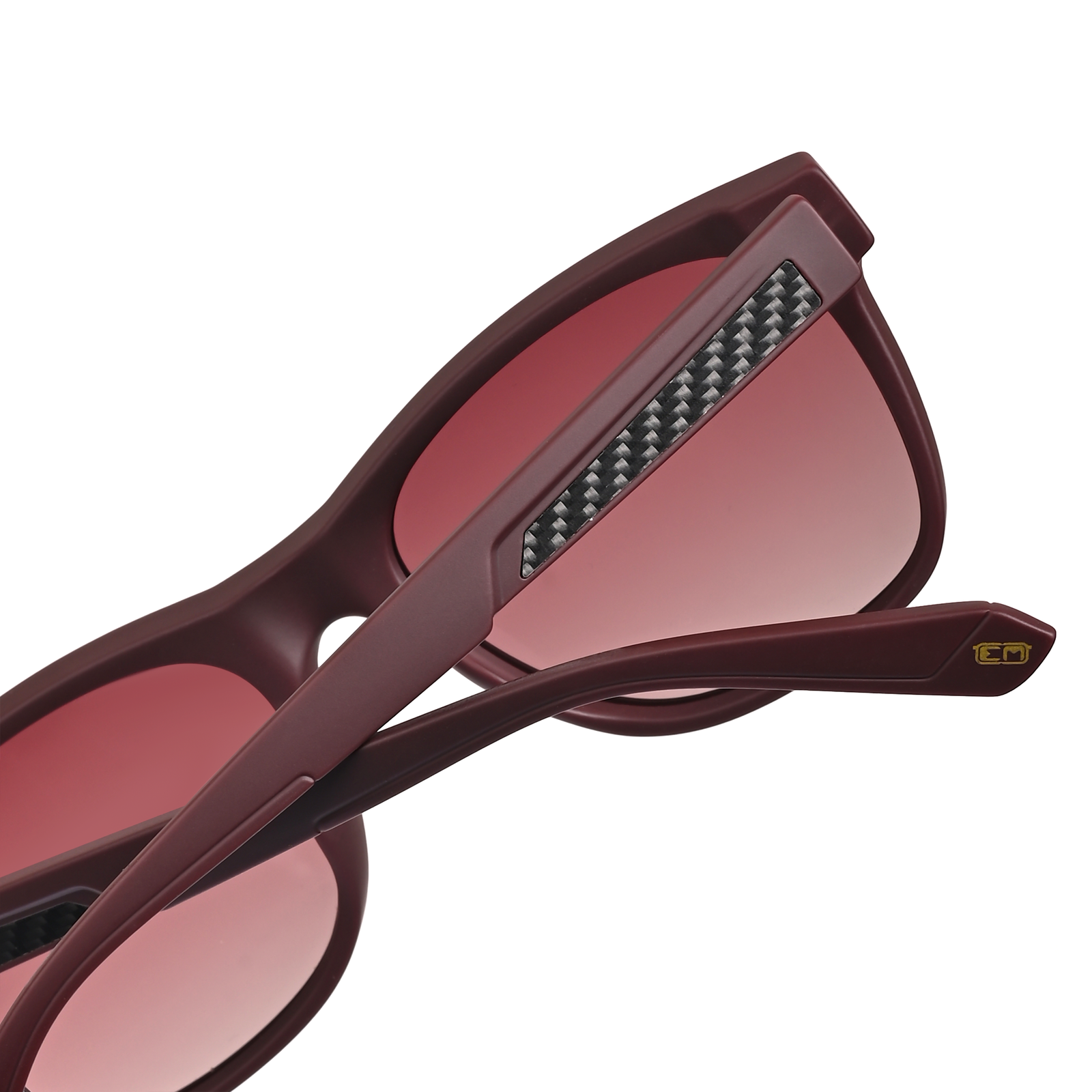 Close-up of maroon Aventus - Velour sunglasses with tinted lenses and textured carbon fiber detail on the temple arm for a sleek modern look.