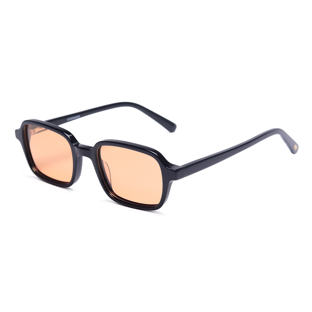 Minimal black frame sunglasses with soft peach tinted lenses (Vaune SonisFlare)