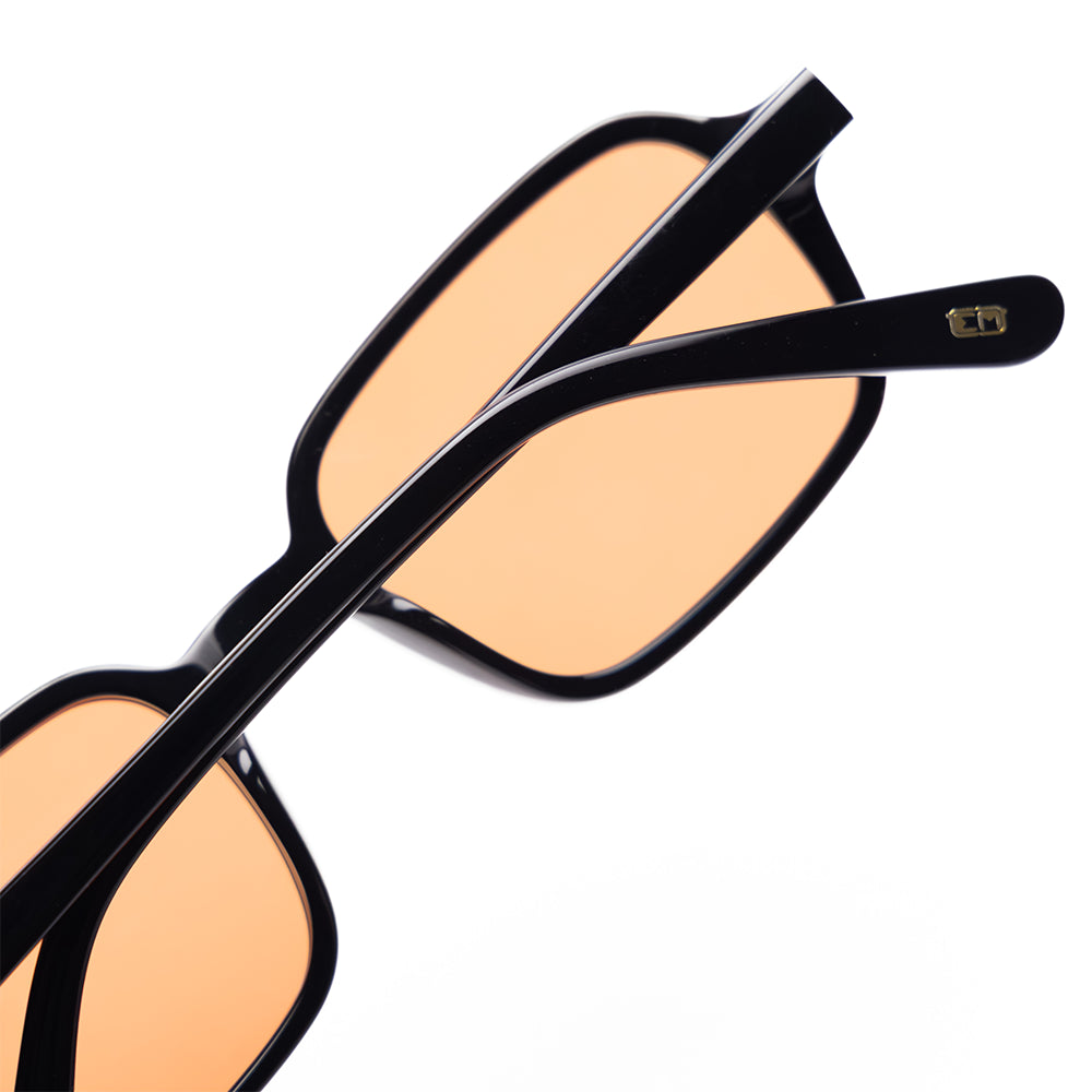 Angular black frame sunglasses with warm tinted lenses (Vaune SonisFlare3)